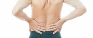 Man with back pain - lower back pain effect 40, 50 and 60 years olds who go to the gym