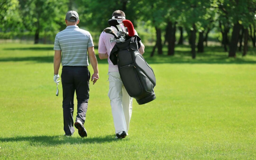 What can I do to ease my lower back pain when playing golf?
