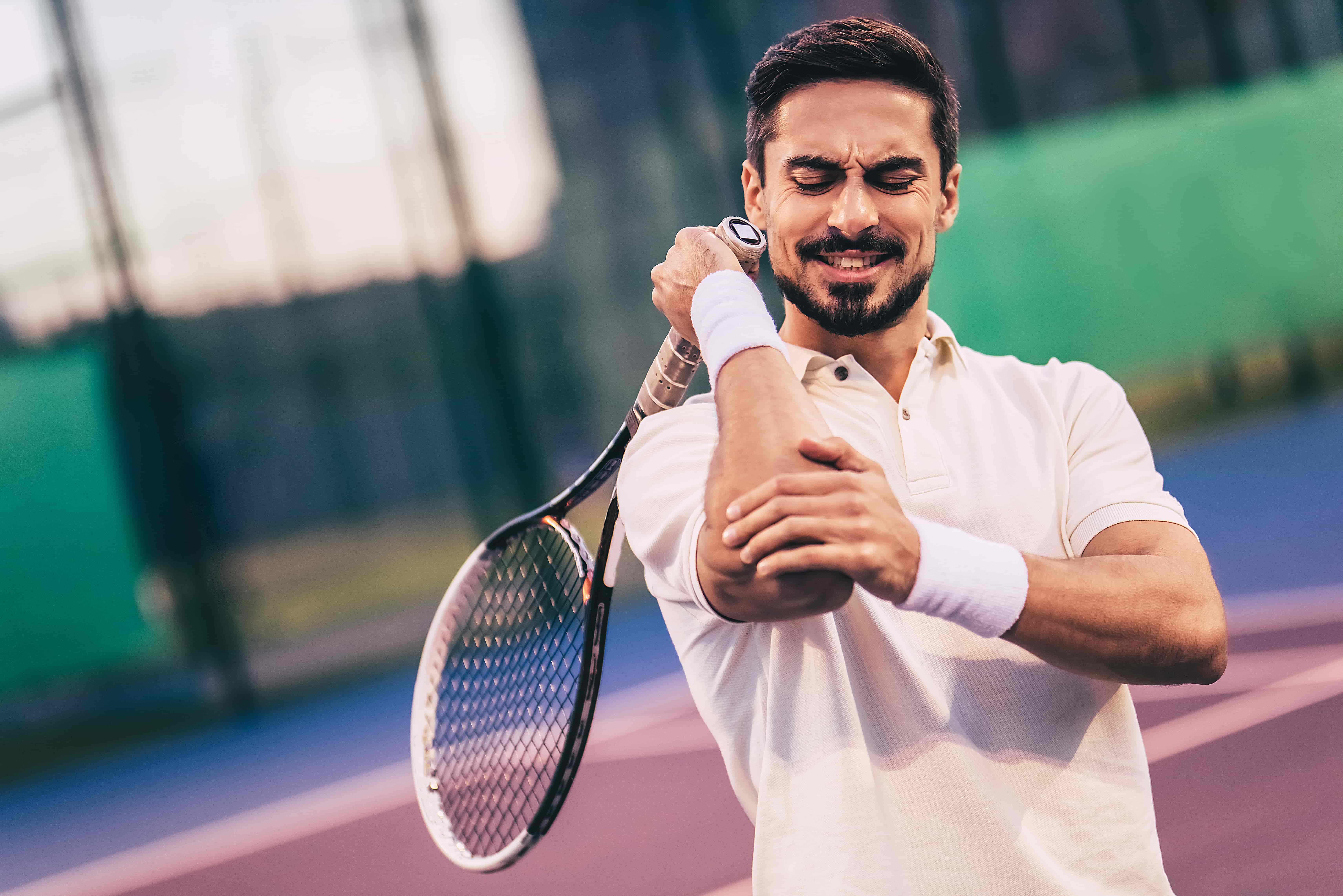 How can a tennis player develop pain around the elbow?